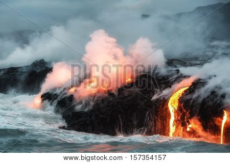 Molten lava flowing into the Pacific Ocean on Big Island of Hawaii