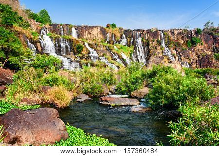 Scenic Natural Cascading Waterfall With Crystal Clear Water