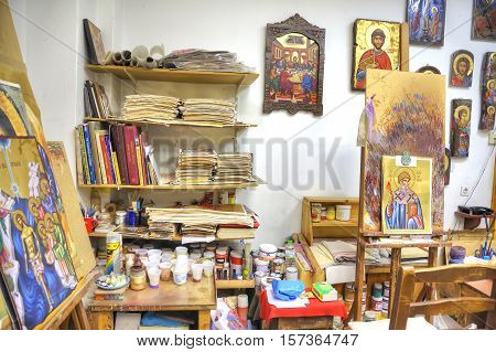 METEORA GREECE - March 13.2016: Ready icons and designs in the icon masterful of souvenir shop