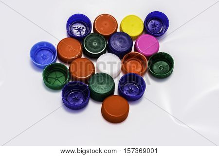 Colored lids from pet on the white background