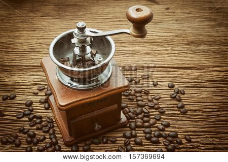 Vintage manual coffee grinder with coffee bean