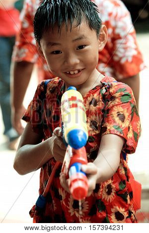Bangkok, Thailand - April 13, 2008 : 
Children play with water guns during Songkran, the Thai New Year's festival.