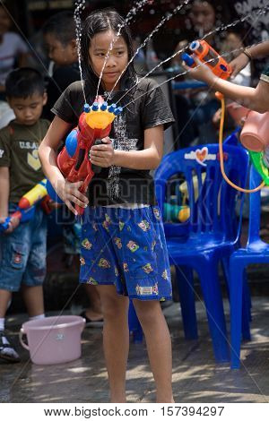 Bangkok, Thailand - April 13, 2008 : 
Children play with water guns during Songkran, the Thai New Year's festival.