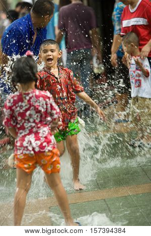 Bangkok, Thailand - April 13, 2008 : 
Children play with water guns during Songkran, the Thai New Year's festival.