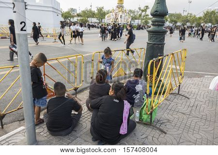 BANGKOK THAILAND - OCT 28 : snap shot of mourners on Sanam Chai road road in Sanam Luang area while the funeral of king Bhumibol Adulyadej in Grand Palace on october 28 2016