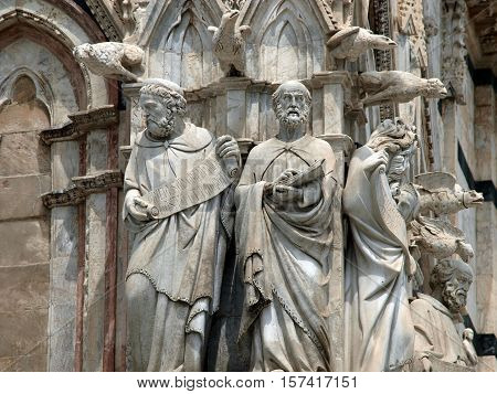 Architectural details of Duomo facade - SienaTuscanyItaly. The Duomo of Siena which was built in the 12th and 13th centuries is one of the prettiest churches in Gothic style in Italy