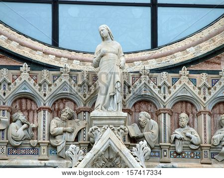 Architectural details of Duomo facade - SienaTuscanyItaly. The Duomo of Siena which was built in the 12th and 13th centuries is one of the prettiest churches in Gothic style in Italy