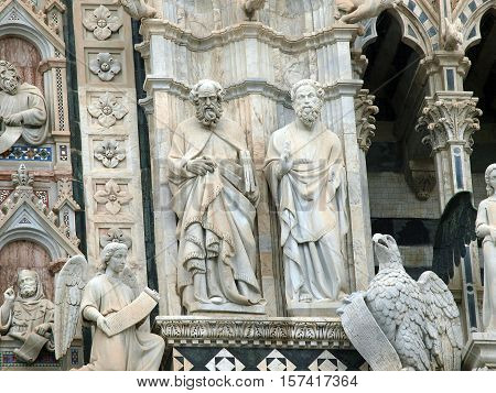 Architectural details of Duomo facade - SienaTuscanyItaly. The Duomo of Siena which was built in the 12th and 13th centuries is one of the prettiest churches in Gothic style in Italy