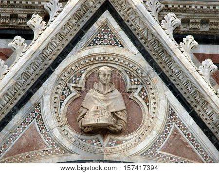 Architectural details of Duomo facade - SienaTuscanyItaly. The Duomo of Siena which was built in the 12th and 13th centuries is one of the prettiest churches in Gothic style in Italy