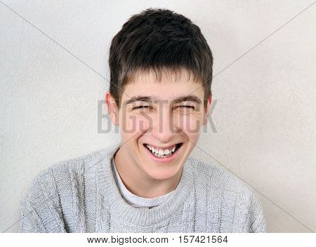 Cheerful Teenager Portrait on the White Wall Background