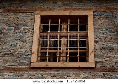 Window at one old Bulgarian house in the village of Kovachevitsa, Bulgaria