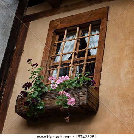 Window at one old Bulgarian house in the village of Kovachevitsa, Bulgaria