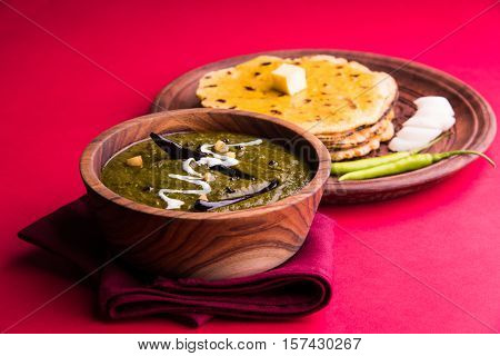 corn flour flat bread or roti or Makki Ki Roti with sarso da Saag or mustard leaves curry, Indian Food popular in winter season in north india