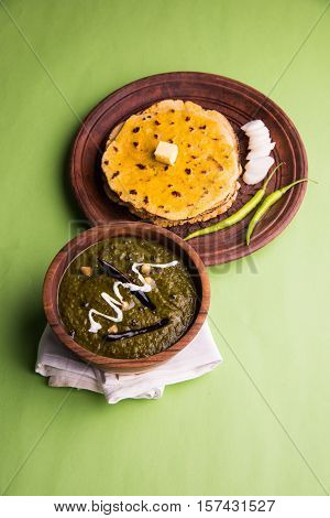 corn flour flat bread or roti or Makki Ki Roti with sarso da Saag or mustard leaves curry, Indian Food popular in winter season in north india