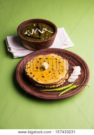 corn flour flat bread or roti or Makki Ki Roti with sarso da Saag or mustard leaves curry, Indian Food popular in winter season in north india