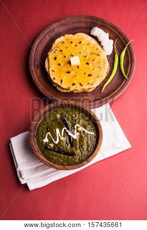 corn flour flat bread or roti or Makki Ki Roti with sarso da Saag or mustard leaves curry, Indian Food popular in winter season in north india
