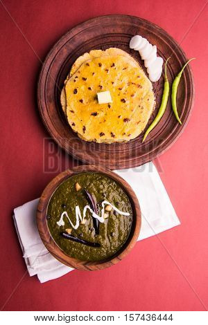 corn flour flat bread or roti or Makki Ki Roti with sarso da Saag or mustard leaves curry, Indian Food popular in winter season in north india