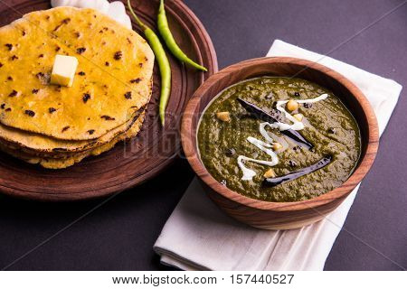 corn flour flat bread or roti or Makki Ki Roti with sarso da Saag or mustard leaves curry, Indian Food popular in winter season in north india