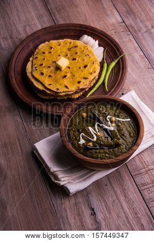 corn flour flat bread or roti or Makki Ki Roti with sarso da Saag or mustard leaves curry, Indian Food popular in winter season in north india