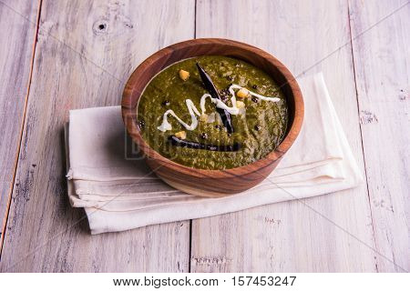 corn flour flat bread or roti or Makki Ki Roti with sarso da Saag or mustard leaves curry, Indian Food popular in winter season in north india