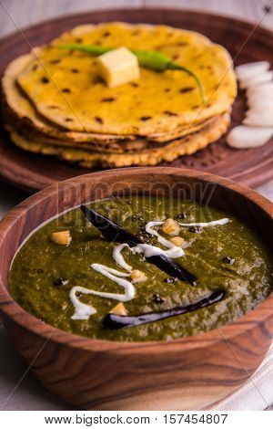 corn flour flat bread or roti or Makki Ki Roti with sarso da Saag or mustard leaves curry, Indian Food popular in winter season in north india