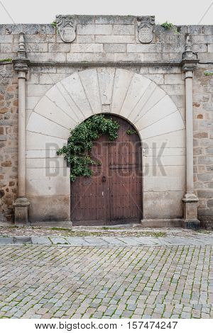 Manor entrance of palace with Roman arch