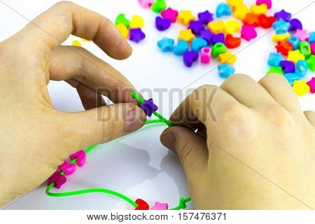 Making of handmade jewellery multi colored beads isolated