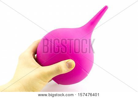 Enema in hand isolated on white background.