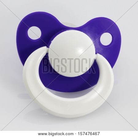 The orthodontic pacifier isolated on a white