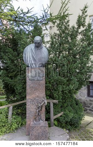 ZAKOPANE POLAND - SEPTEMBER 23 2016: Monument to the writer Kornel Makuszynski together with a statue of the Goat who was the hero of fairy tales written by the author.