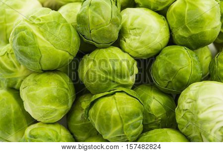 a pile of Brussels sprouts on a white background