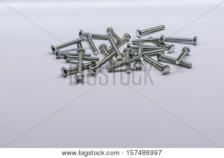 Some bolts and nuts on white background