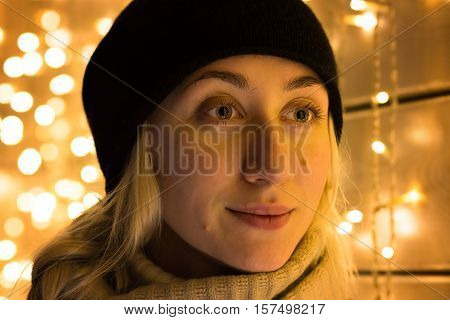 Art portrait of a beautiful girl. Gorgeous blonde girl portrait in night city lights. Vogue fashion style portrait of young pretty beautiful woman with long blonde curly hair.