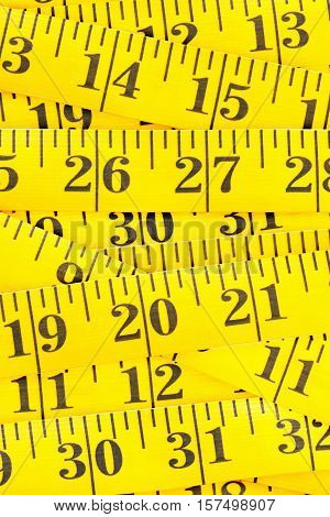 Frame filling yellow measurement tape background texture