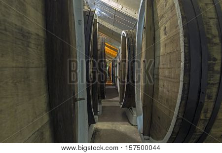 Aging of fortified and dessert wines in oak barrels in the cellars of the Sunny Valley winery Crimea.