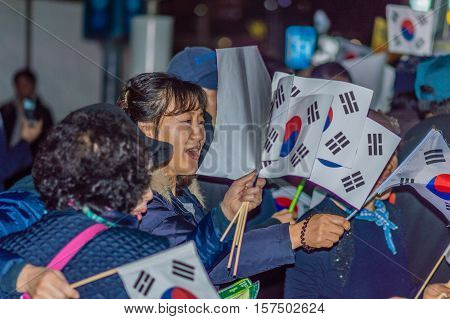 SEOUL, SOUTH KOREA, NOVEMBER 19,2016 Group of protesters outside Seoul Station rally against impeachment of President Park Geun-hye