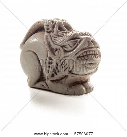 Small Japanese accessory of a mythical beast. A miniature sculpture which was used as a button-like trinket in traditional Japanese clothes kimono kosode which was devoid of pockets.