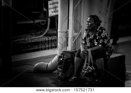 Bangkok, Thailand - November 20, 2016 : Thai Woman wait for departure time at the head train terminal station in Bangkok