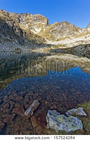 Stones in the water of Elenski lakes and Malyovitsa peak, Rila Mountain, Bulgaria