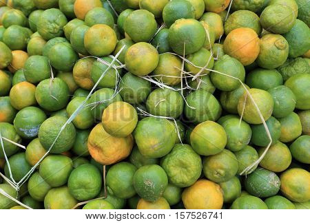 closeup fo yellow and green fresh oranges