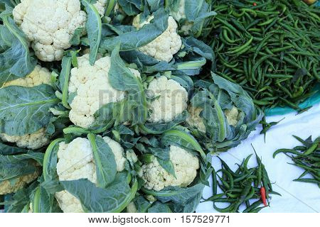 fresh cauliflower and chili selling at the street shop