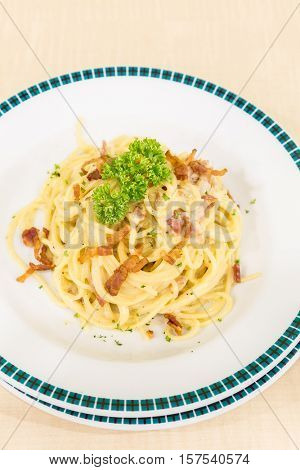 spaghetti carbonara with bacon, italian groumet cuisine