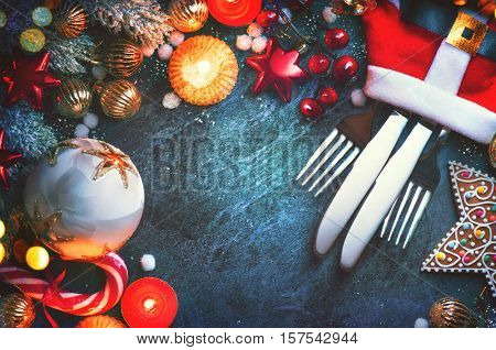 Christmas Dinner holiday table setting, Christmas and New Year celebration, served table with baubles, candles and Christmas decorations. Winter Holiday food background