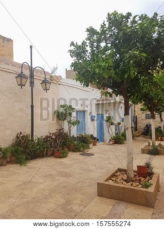 Ancient Greek streets Beautiful cozy courtyards. vacation in Greece