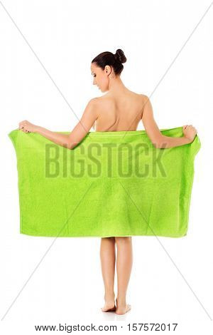 Young beautiful woman after bath full portrait isolated over white.