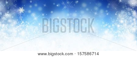 Blue abstract winter background with snow and snowflackes. Long format.