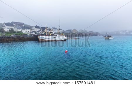 Small Traditional Fishing Boat Stands Moored In Norway.
