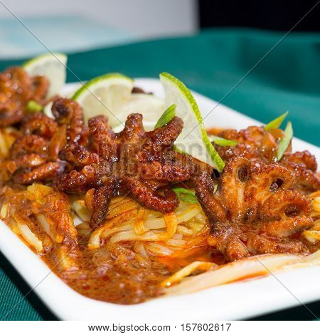 Grilled baby-octopus in a sauce of cream and paprika