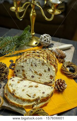 Fresh baked raisins bread sliced on granite board holiday concept