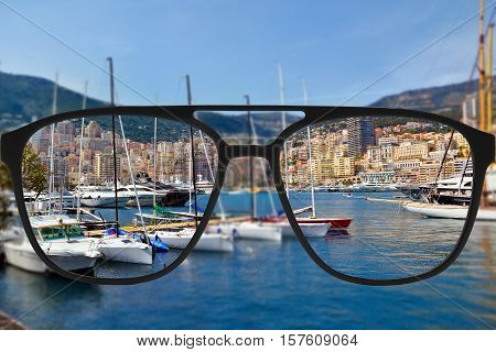 Clear image in glasses against blurry landscape